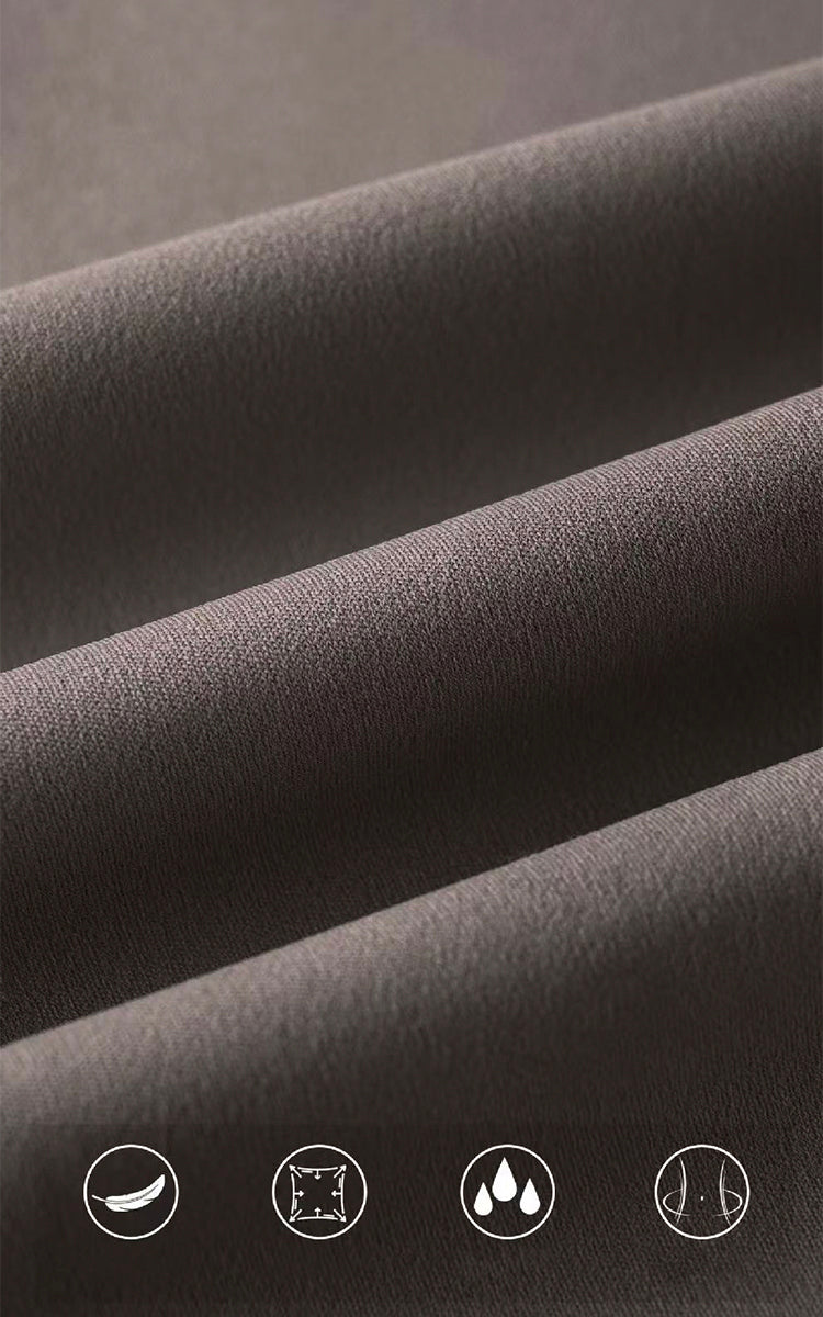 Close-up of brown fabric with care label icons at the bottom